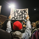 Demonstrators protest outside the Ferguson, Mo., Police Department on Oct. 11, 2014.
Scott Olson/Getty Images